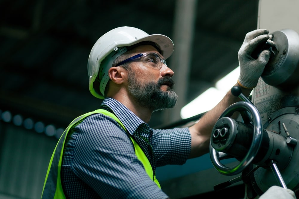 Worker Operating A Heavy Machinery